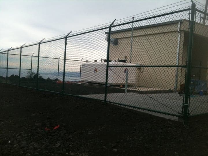 commercial grade green 8 feet tall with high security barb wire on top this job is high in the kona mountains — On The Line Fencing project, Big Island, Hawaii