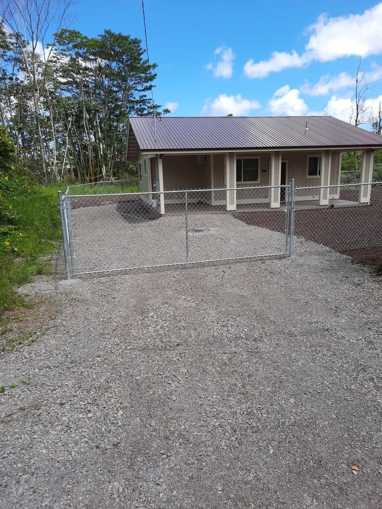 Fenced yard with front gate and a rear pedestrian gate — On The Line Fencing project, Big Island, Hawaii